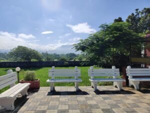 Sitting Areat at Pool Side with Benches at Farm House